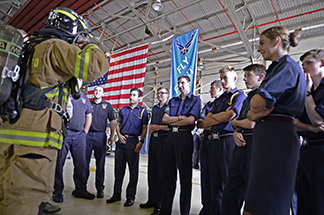 image of a Firefighter talking to a group of people